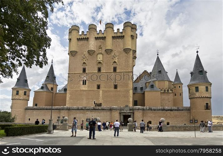Tourists around the El Alcazar castle in Segovia, Spain