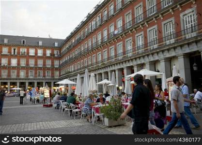 Tourists at a sidewalk cafe, Plaza Mayor, Madrid, Spain