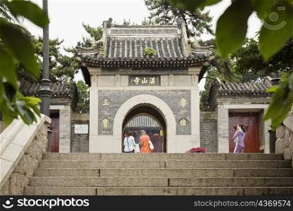 Tourists at a temple, Zhanshan Temple, Qingdao, Shandong Province, China