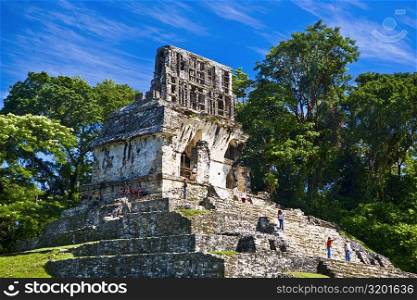 Tourists at old ruins of a temple, Templo De La Cruz, Palenque, Chiapas, Mexico