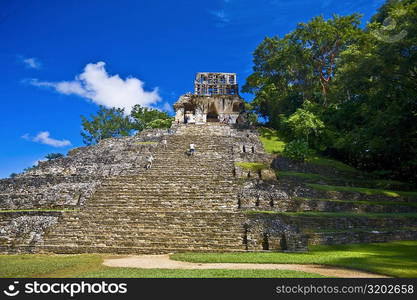 Tourists at old ruins of a temple, Templo De La Cruz, Palenque, Chiapas, Mexico