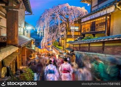 Tourists at old town Kyoto, the Higashiyama District during sakura season in Japan