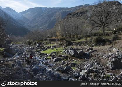 Tourists at stream in a valley, Imlil, Atlas Mountains, Morocco