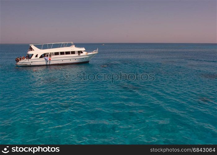 Tourists boat anchored in a bay in the red sea for snorkeling,luxury yacht.