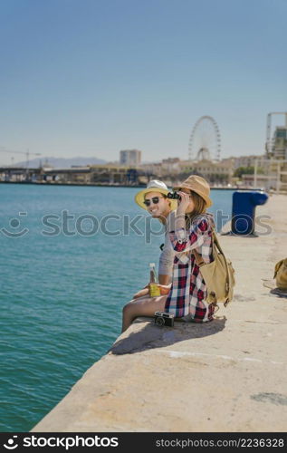 tourists coast with binoculars