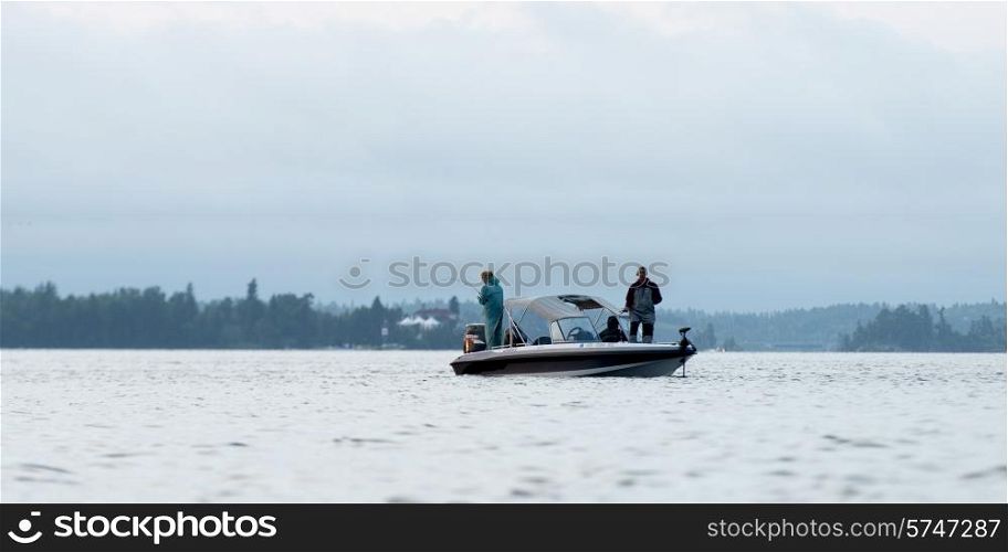 Tourists fishing from a boat, Lake of The Woods, Ontario, Canada