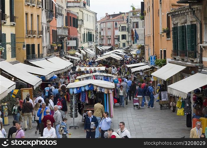 Tourists in a street market, Venice, Italy