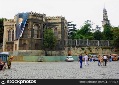 Tourists in front of a building, Walls of Constantinople, Istanbul, Turkey