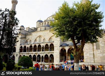 Tourists in front of a mosque, Blue Mosque, Istanbul, Turkey