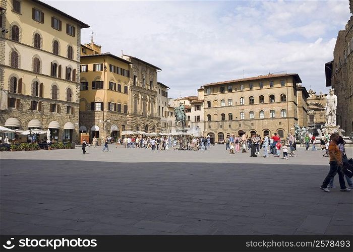 Tourists in front of a palace, Cosme I de Medicis, Pallazo Vecchio, Florence, Italy
