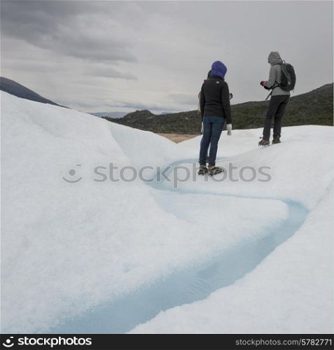 Tourists in snow, Perito Moreno Glacier, Los Glaciares National Park, Santa Cruz Province, Patagonia, Argentina