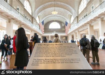 Tourists in the registry room, Ellis Island, Jersey City, New York State, USA