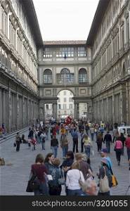 Tourists in the street, Uffizi Museum, Pallazo Vecchio, Florence, Italy