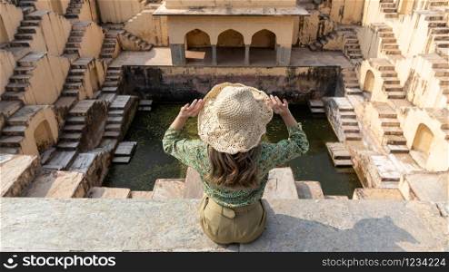 Tourists is exploring ancient Indian step well, Architecture of stairs at Abhaneri baori stepwell in Jaipur, Rajasthan india.