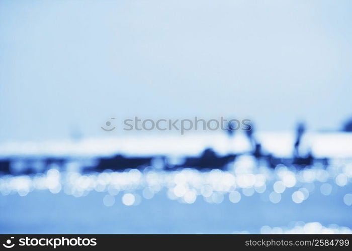 Tourists on a jetty in the sea (Blur)