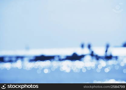 Tourists on a jetty in the sea (Blur)