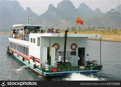 Tourists on a tourboat, Li River, Guilin, China