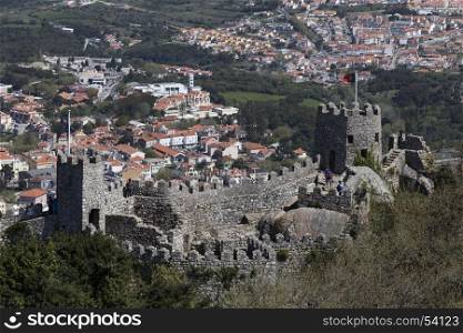 Tourists on the Castle of the Moors at Sintra near Lisbon in Portugal. The castle dates from the 10th century and is now a popular tourist destination. Sintra is known for its many 19th century Romantic monuments and is a UNESCO World Heritage Site.