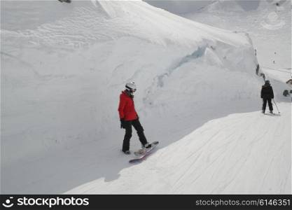 Tourists skiing in snow covered valley, Whistler, British Columbia, Canada