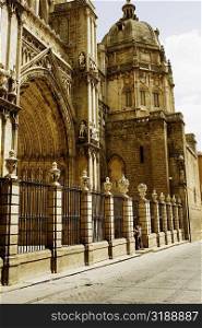 Tourists standing at the entrance of a cathedral, Cathedral Of Toledo, Toledo, Spain