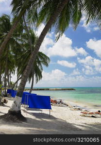 Tourists sunbathing on the beach, Spratt Bight Beach, San Andres, Providencia y Santa Catalina, San Andres y Providencia Department, Colombia