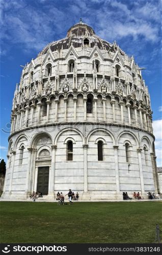 Tourists visiting the Baptistry of St John, part of the Pisa Cathedral Complex