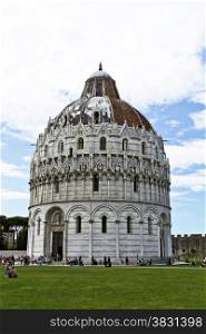Tourists visiting the Baptistry of St John, part of the Pisa Cathedral Complex
