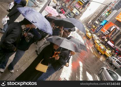 Tourists waiting at the roadside, New York City, New York State, USA
