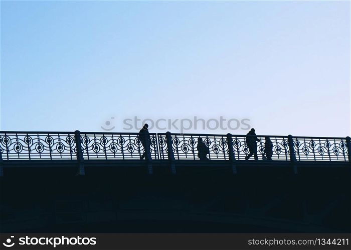 tourists walking across the bridge in Bilbao city, Spain