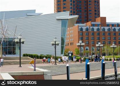 Tourists walking in front of a building, Maryland Science Center, Baltimore, Maryland, USA