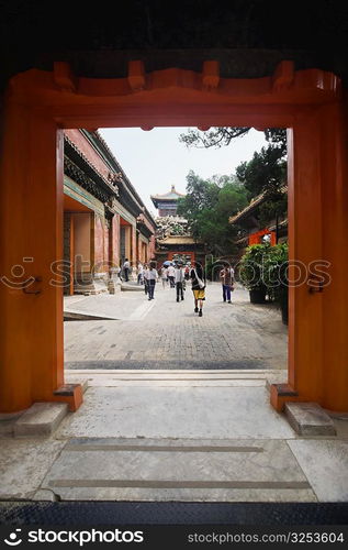 Tourists walking in the courtyard of a palace, Forbidden City, Beijing, China