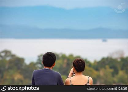 Tourists watch view Srinakarin Dam at Huay Mae khamin waterfall National Park ,Kanchana buri in Thailand.