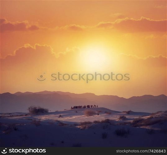 Tourists Watching A Desert Sunset in the White Sands National Monument in Alamogordo, New Mexico.