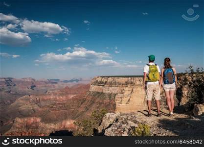 Tourists with backpack hiking at Grand Canyon, Arizona, USA