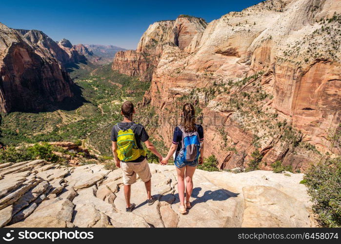 Tourists with backpack hiking in Zion National Park, Utah, USA