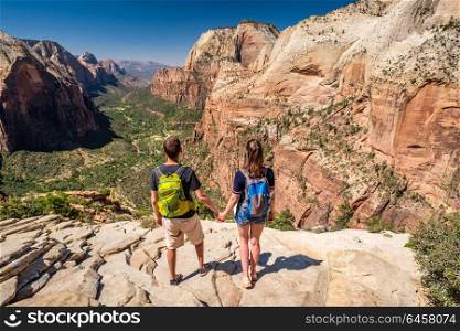 Tourists with backpack hiking in Zion National Park, Utah, USA