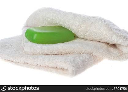towel and green soap lie on table