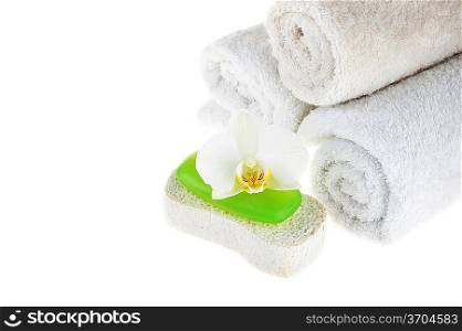 towel, green soap and sponge on white