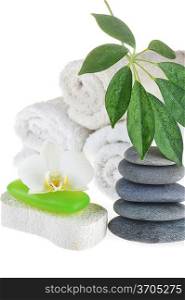 towel, green soap and stones on white