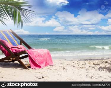 Towel on beach chairs at beautiful tropical beach