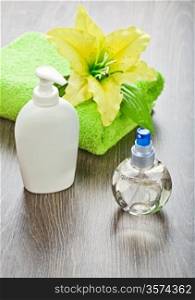 towel with flower and bottles