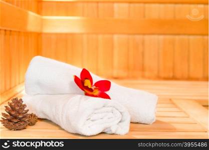 towels and pine cones photographed in the sauna