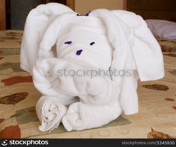 Towels in the shape of a dog on the bed of a hotel room in Cuba.