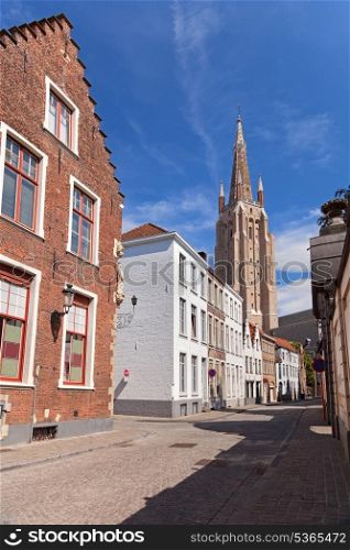 Tower and old houses in Bruges, Belgium&#xA;