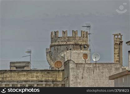 Tower and satellite dishes in the old town of Gallipoli (Le) in the southern of Italy
