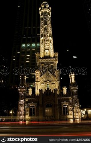 Tower lit up at night, Water Tower, Chicago, Illinois, USA