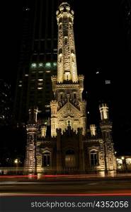 Tower lit up at night, Water Tower, Chicago, Illinois, USA