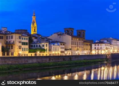 Tower of Basilica of the Holy Cross or Basilica di Santa Croce at twilight and Quay of the river Arno in Florence, Tuscany, Italy