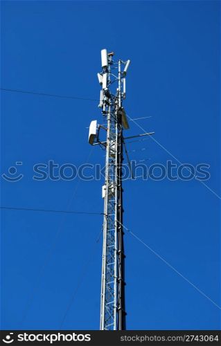 tower of electricity and energy receivers (blue sky background)