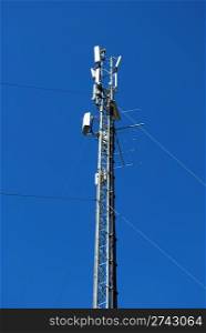 tower of electricity and energy receivers (blue sky background)